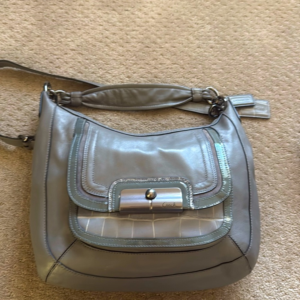 Brand new Coach purse. Only used one time, lots of detail!